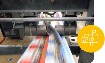 direct mail printed pieces pass under a machine rotor